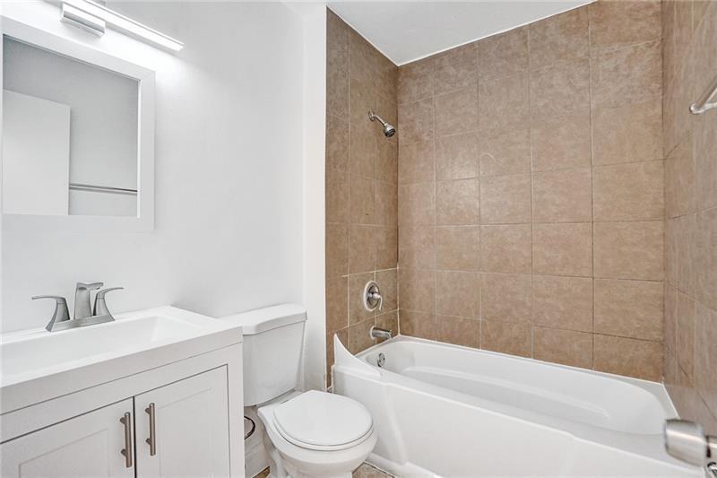 8221 Southwest 3rd Court Pompano Beach, FL 33068 - Photo 21 of 25 a bathroom with a sink a toilet and shower