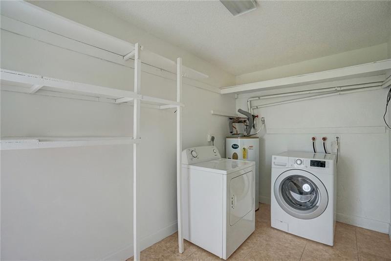 8221 Southwest 3rd Court Pompano Beach, FL 33068 - Photo 22 of 25 a utility room with dryer and washer