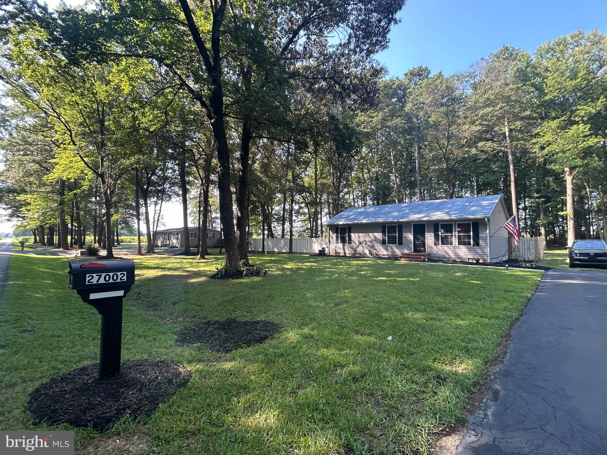 a view of a house with backyard sitting area and garden