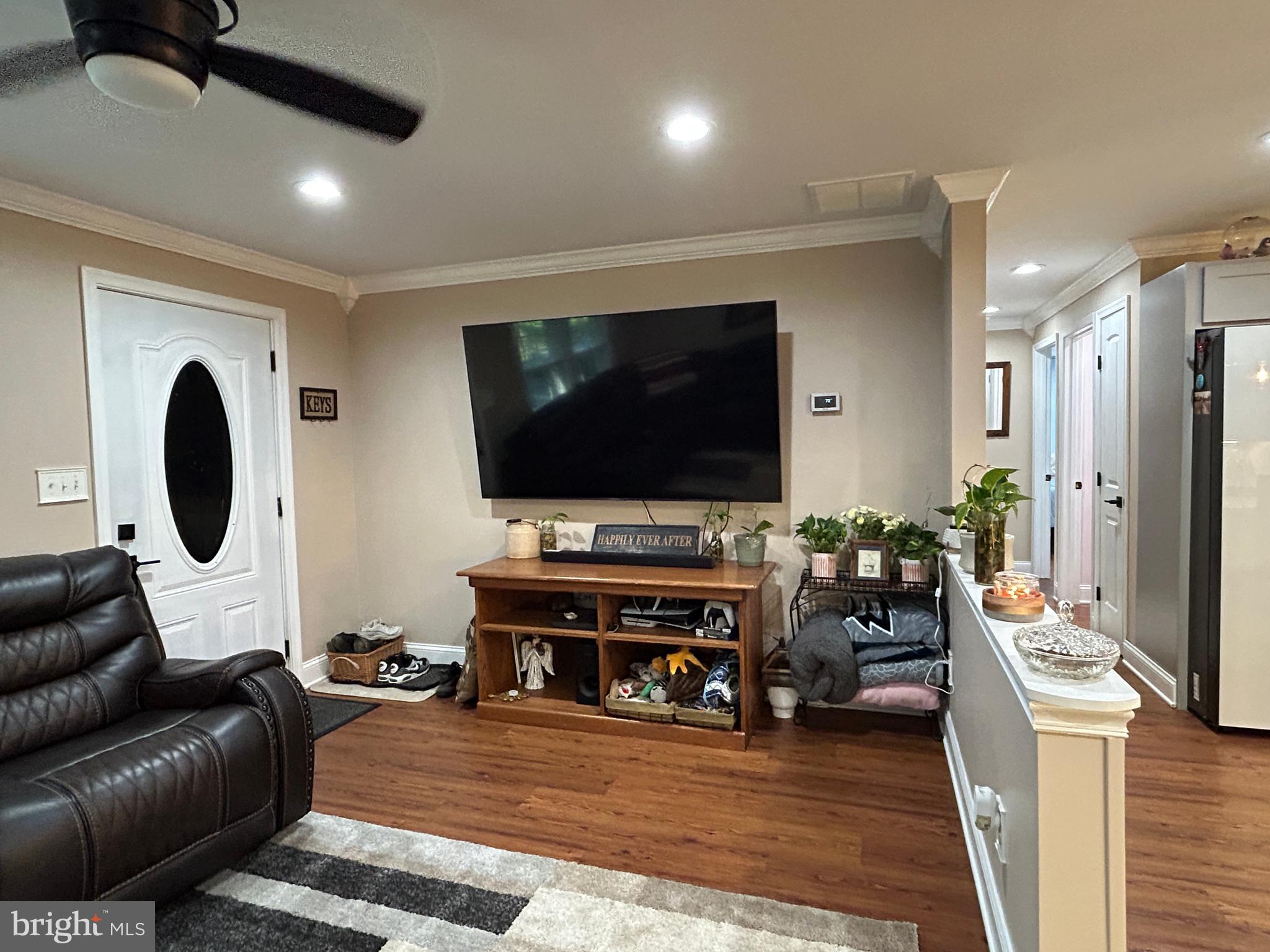 27002 Kaye Road Laurel, DE 19956 - Photo 11 of 64 a living room with furniture and a flat screen tv