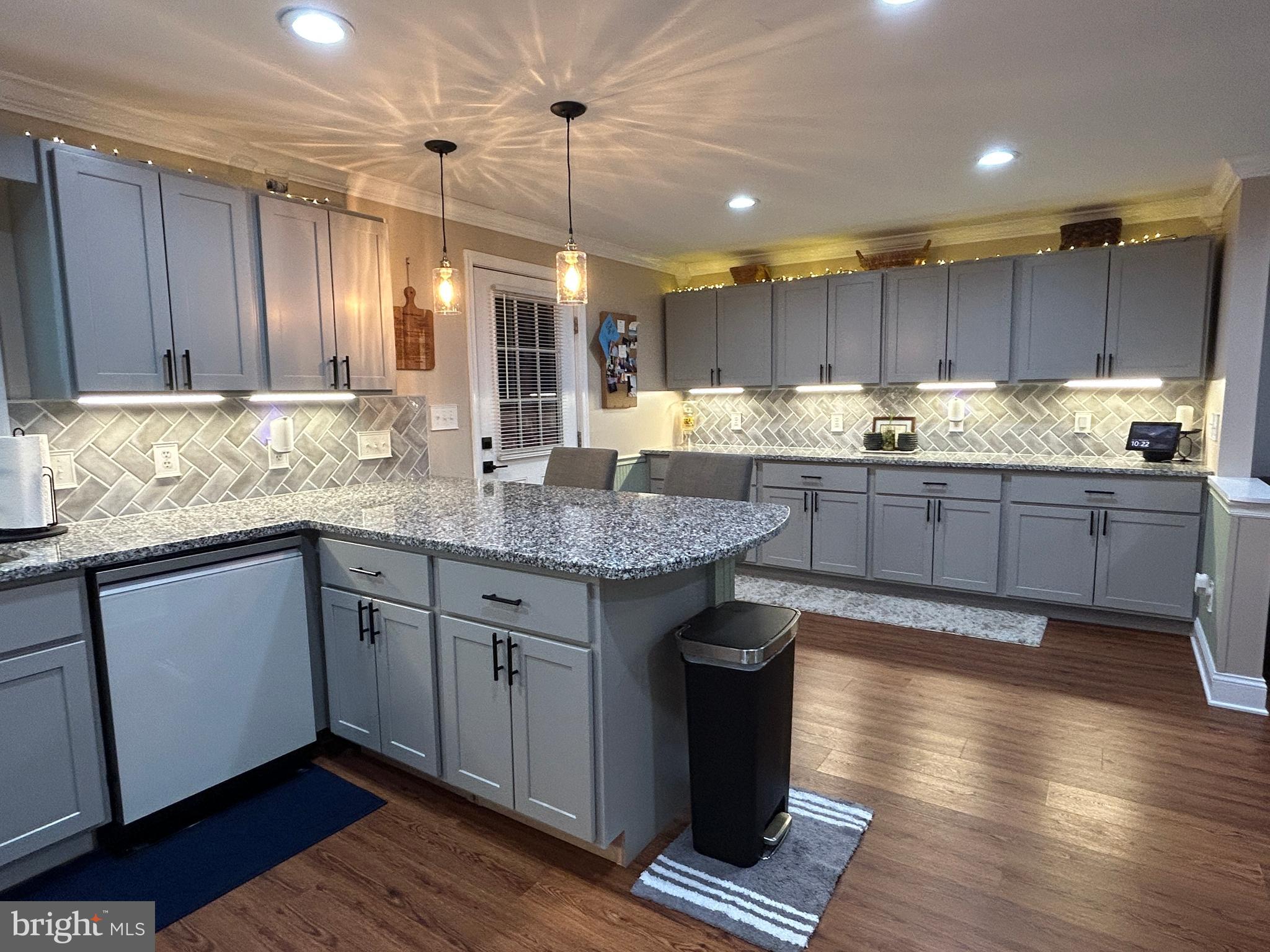 27002 Kaye Road Laurel, DE 19956 - Photo 18 of 64 a kitchen with granite countertop a sink stove and cabinets