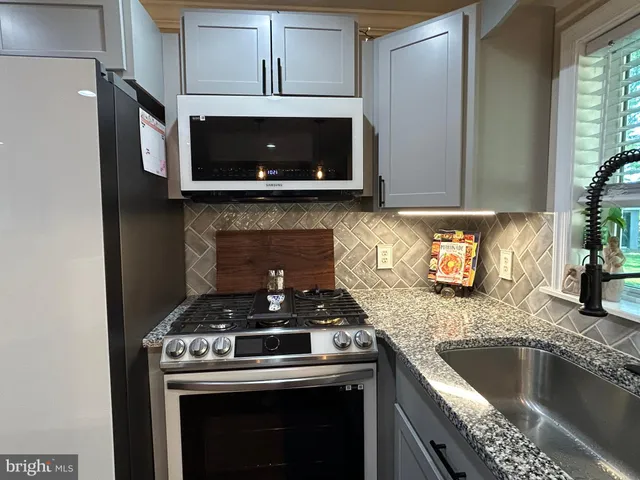 a view of a hallway with wooden shelves