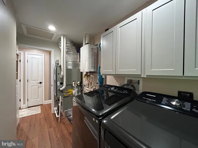a bedroom with a bed and cabinets