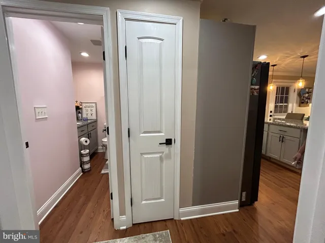 a spacious bedroom with a bed and a window