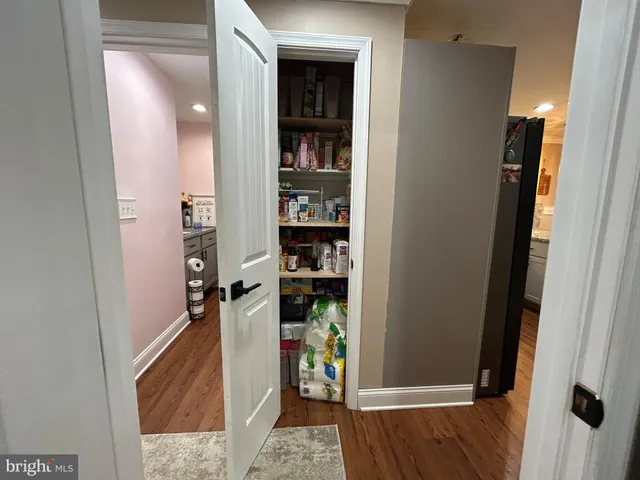 a bedroom with a large bed and a large mirror