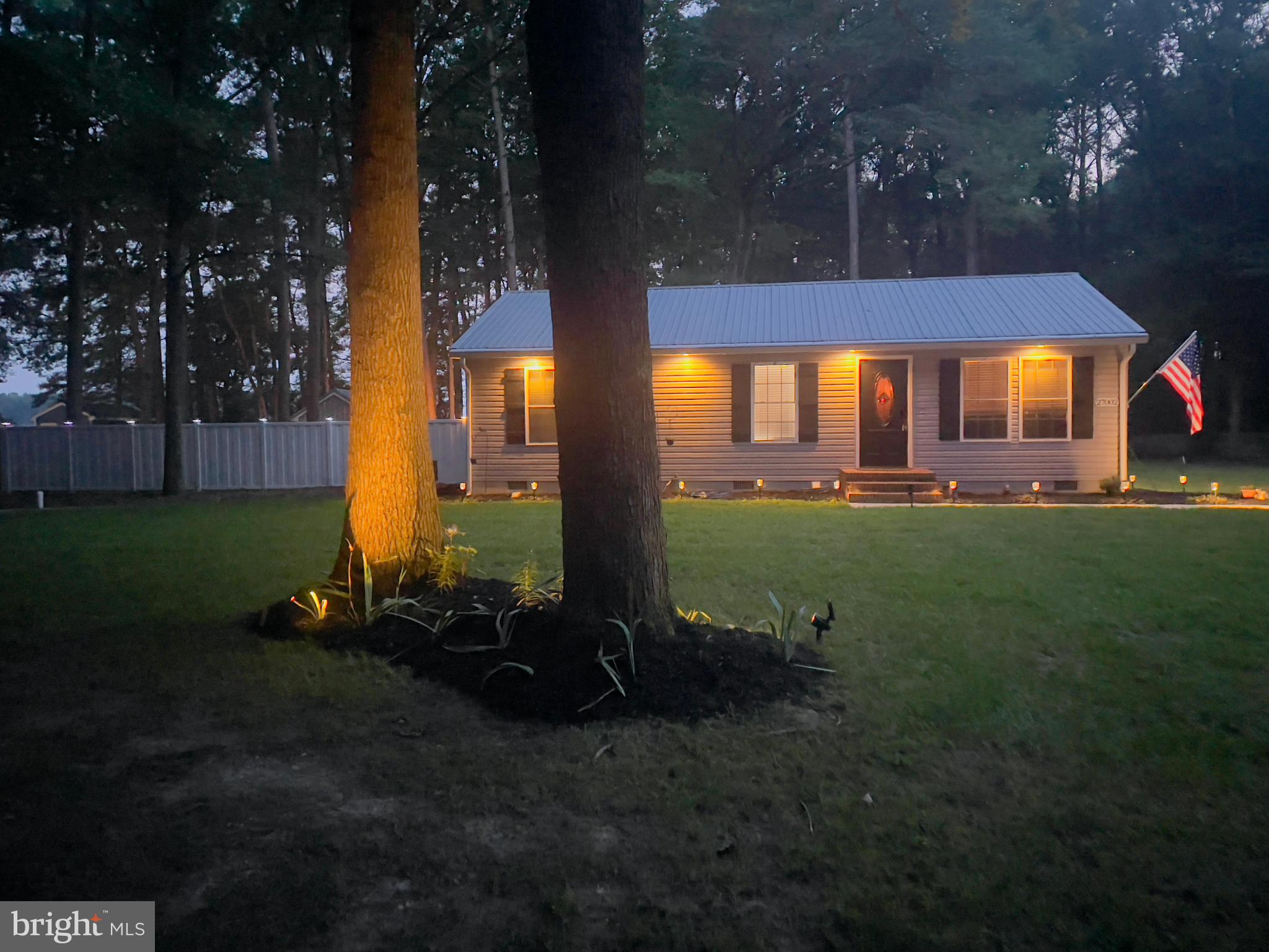 27002 Kaye Road Laurel, DE 19956 - Photo 3 of 64 a backyard of a house with lots of green space and fountain