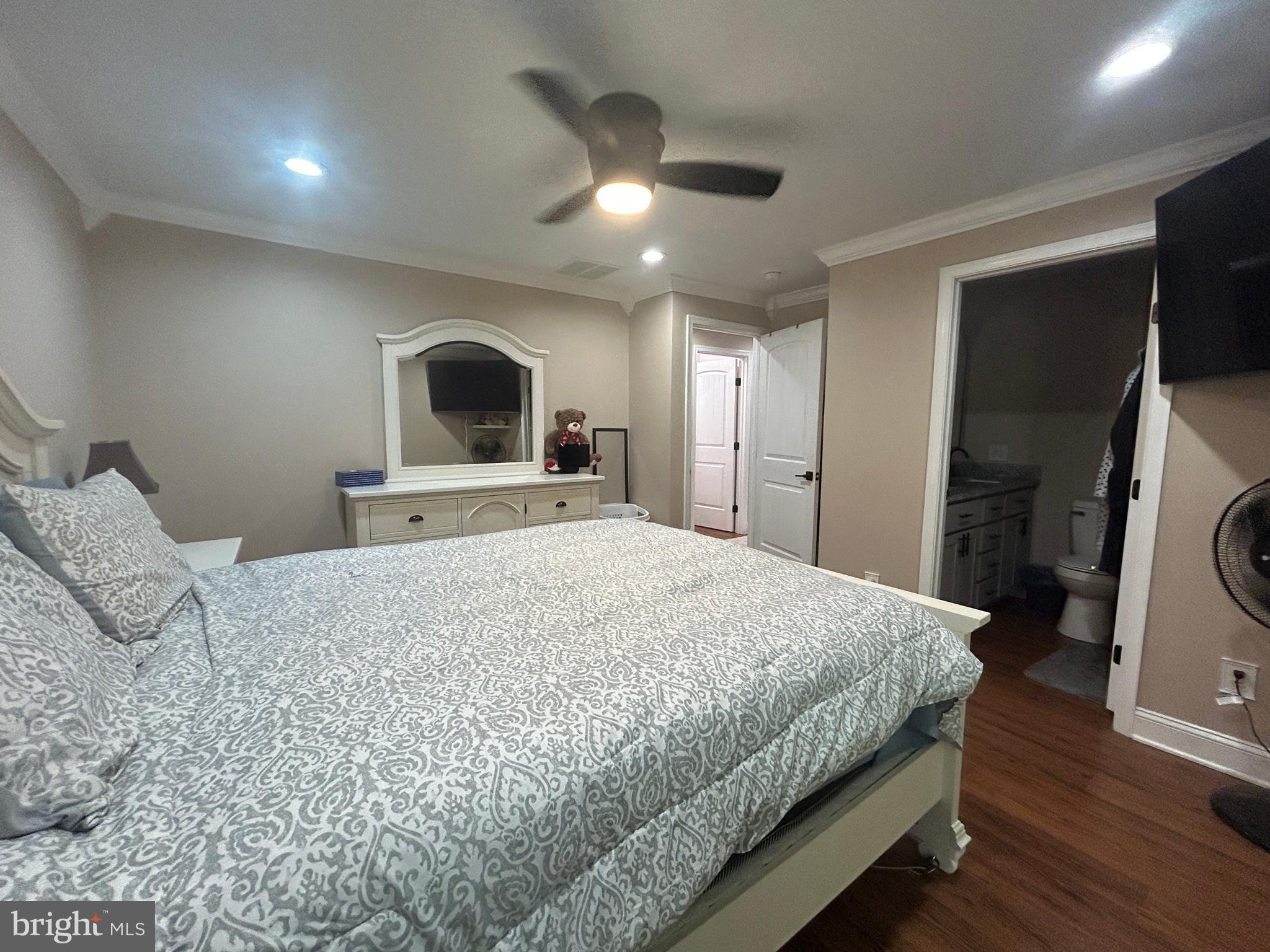 27002 Kaye Road Laurel, DE 19956 - Photo 36 of 64 a spacious bedroom with a bed and a large mirror