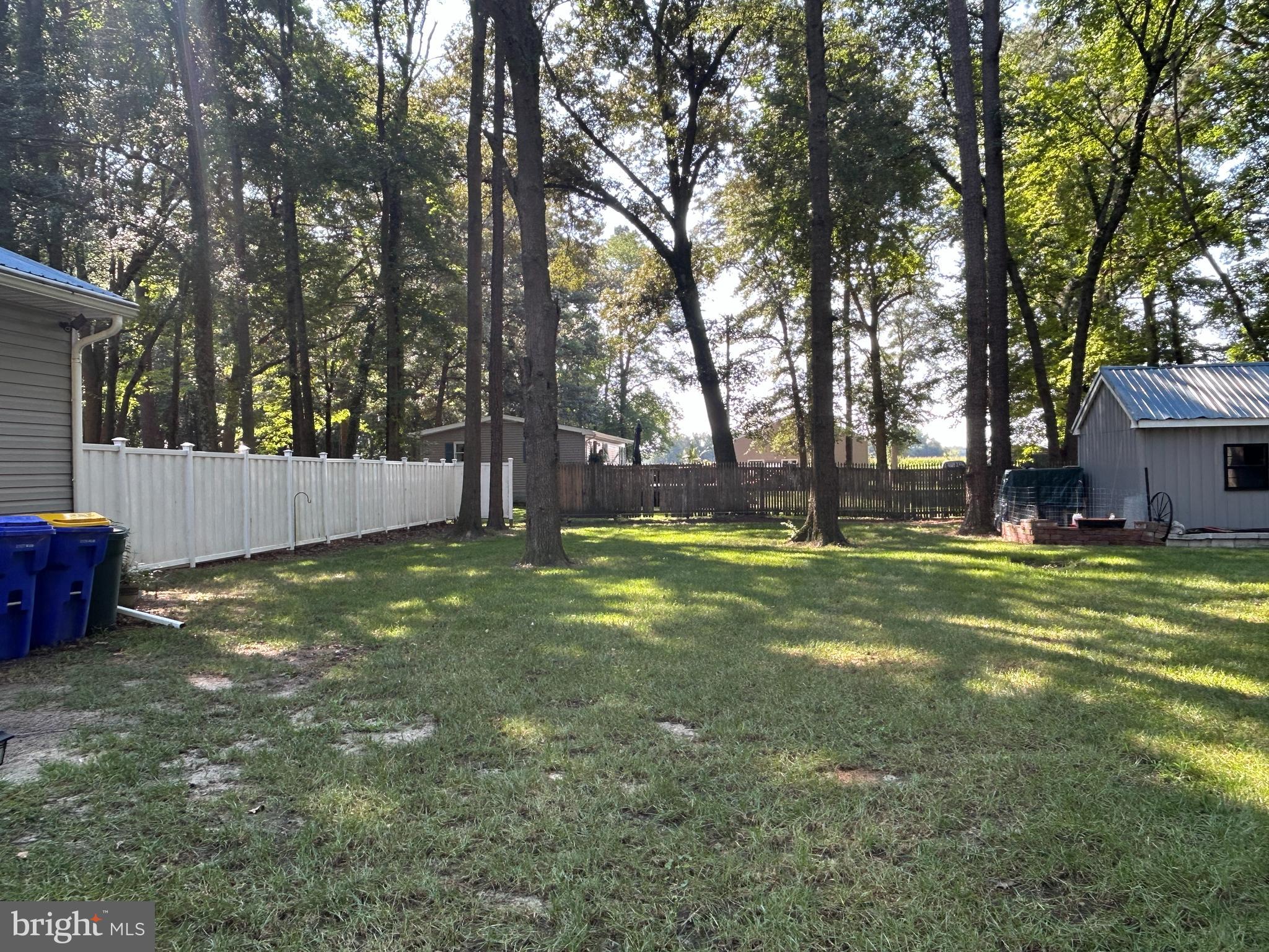 27002 Kaye Road Laurel, DE 19956 - Photo 49 of 64 a view of a backyard with tree and wooden fence