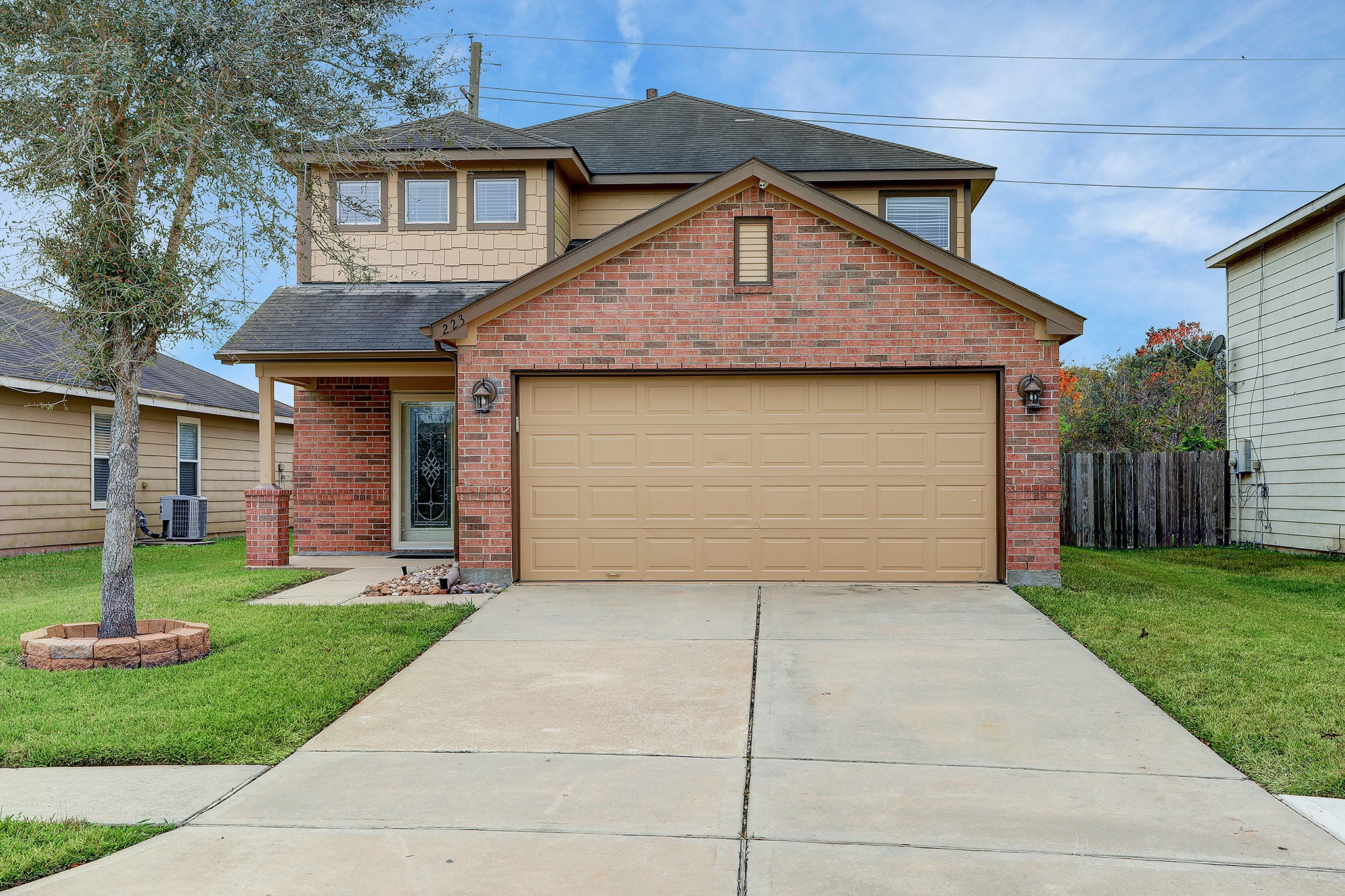 This beautiful brick front home awaits you, featuring a covered front patio and doublewide driveway.