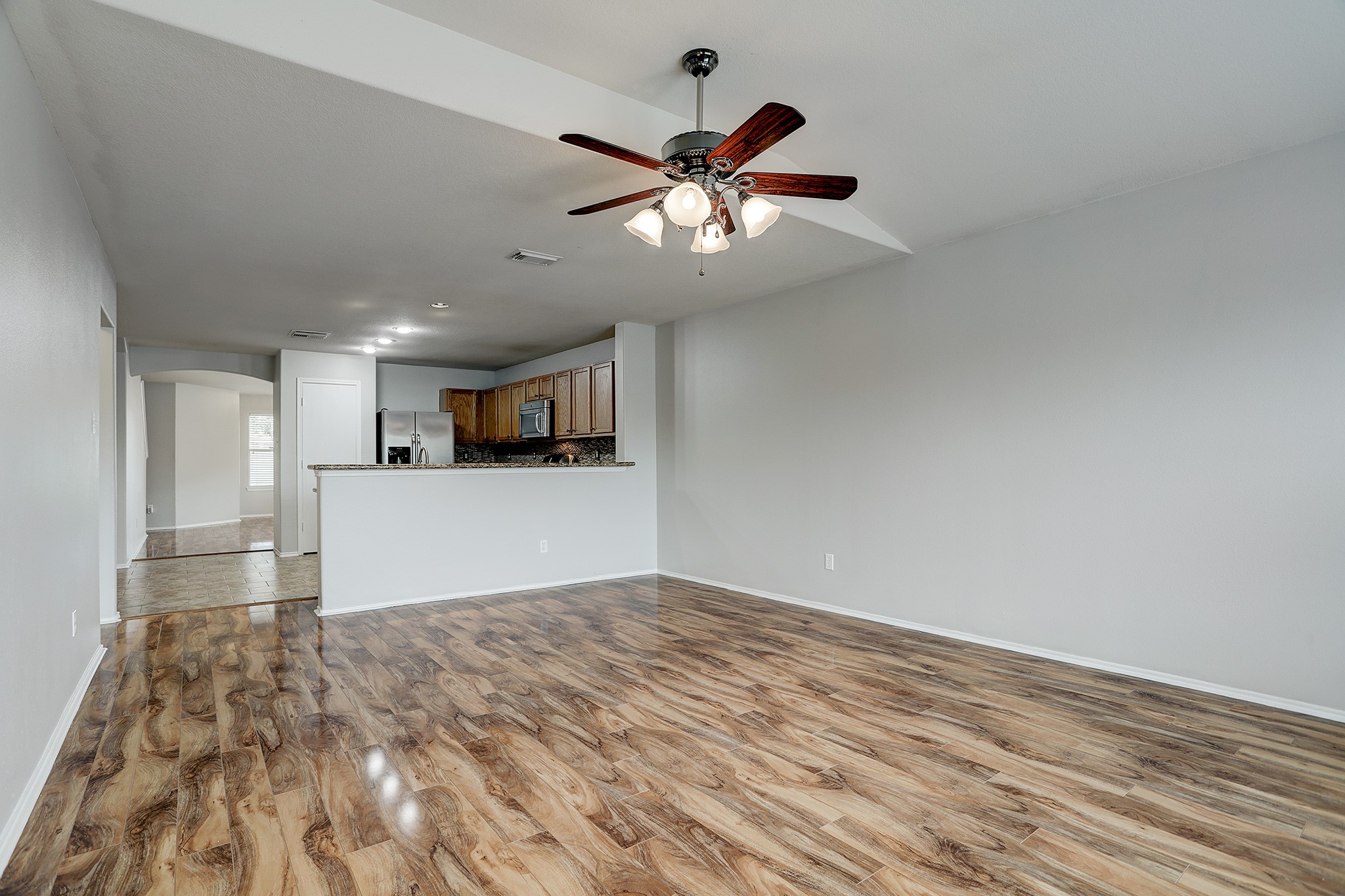 223 Sunset Colony Drive Rosharon, TX 77583 - Photo 11 of 45 A view from the back of the home towards the kitchen. Great natural lighting throughout.