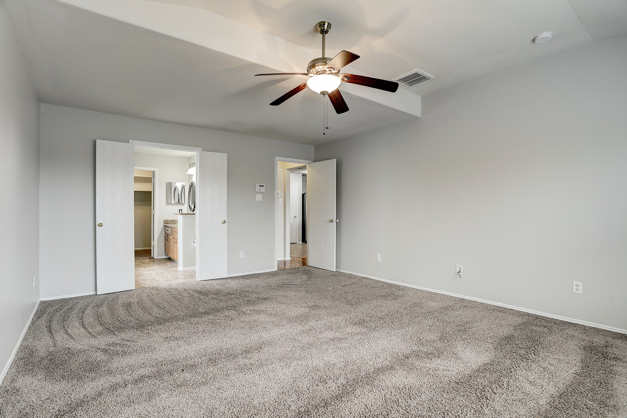 223 Sunset Colony Drive Rosharon, TX 77583 - Photo 16 of 45 On the main floor, find a large primary with neutral carpet and paint.