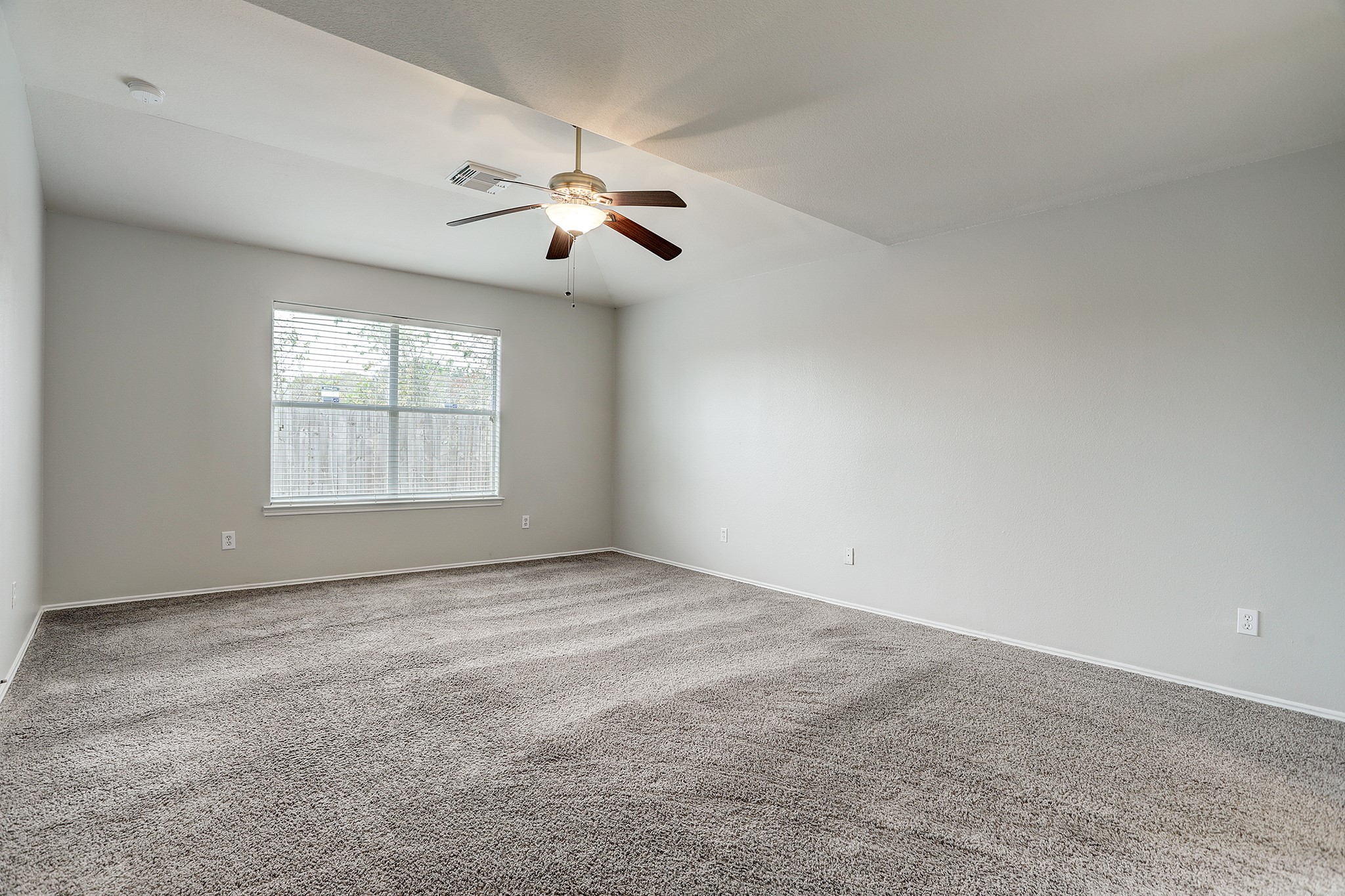 223 Sunset Colony Drive Rosharon, TX 77583 - Photo 17 of 45 The natural light continues throughout the primary bedroom. Keep cool with a ceiling fan.