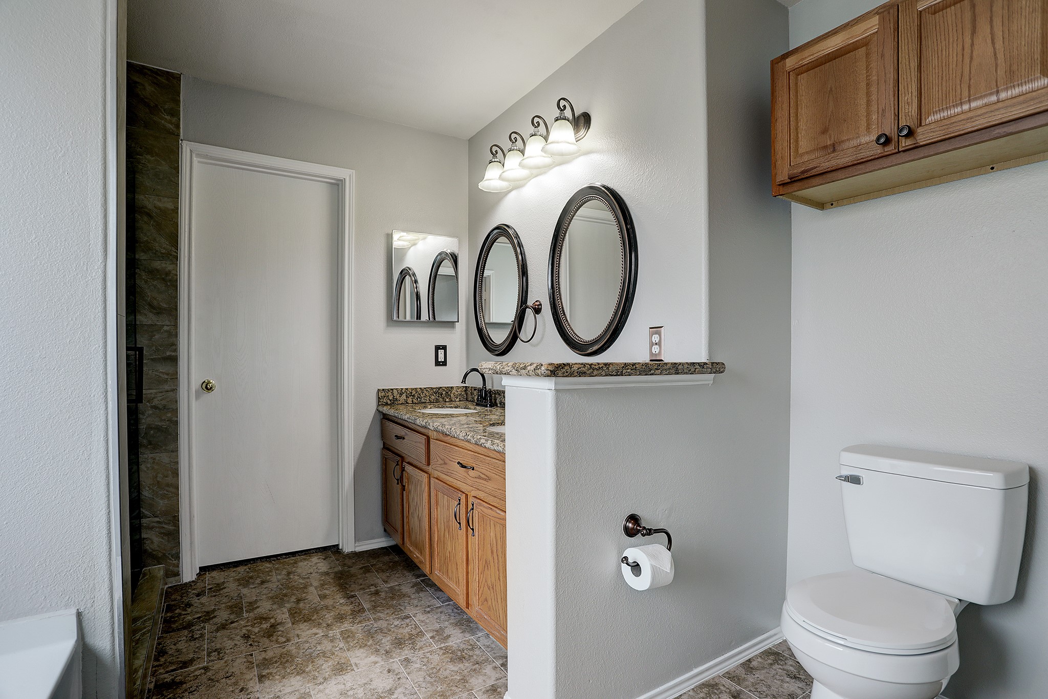 223 Sunset Colony Drive Rosharon, TX 77583 - Photo 19 of 45 Find tile floors and more storage throughout the primary bath.
