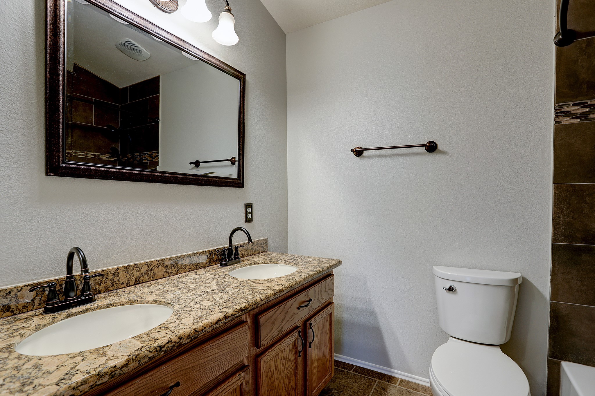223 Sunset Colony Drive Rosharon, TX 77583 - Photo 23 of 45 Secondary upstairs bathroom features granite counters and a double sink.
