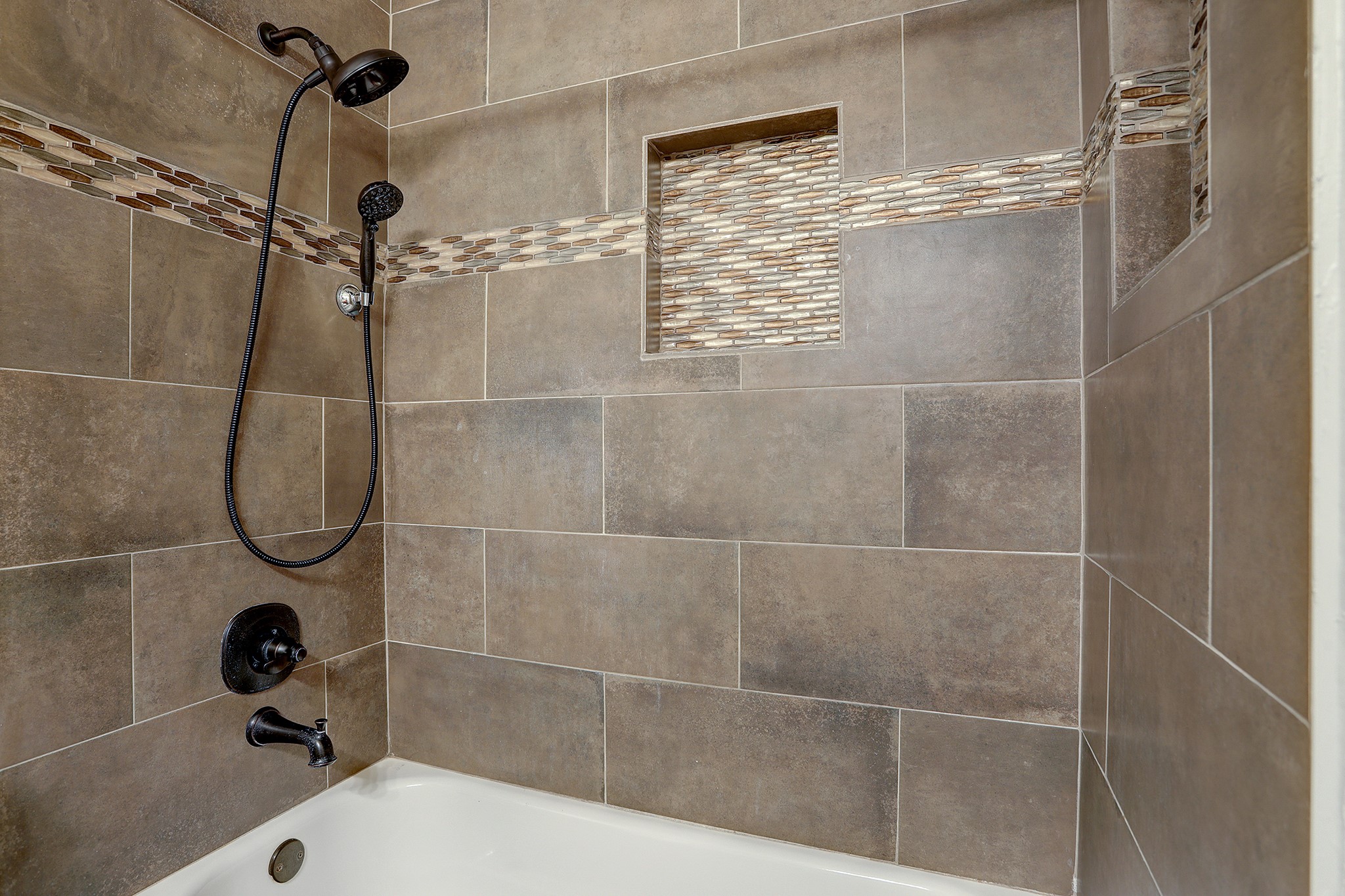 223 Sunset Colony Drive Rosharon, TX 77583 - Photo 24 of 45 Find a nicely tiled showed and tub in the secondary bath.