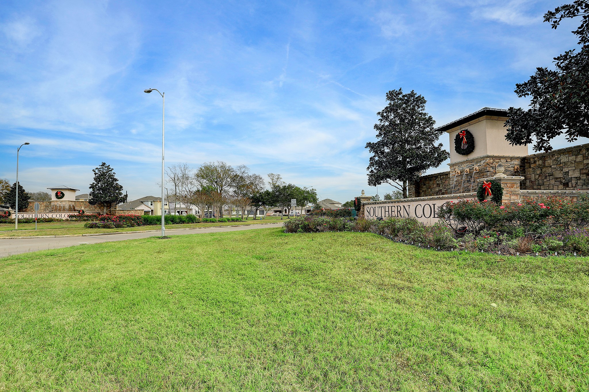 223 Sunset Colony Drive Rosharon, TX 77583 - Photo 35 of 45 Water features and lovely landscaping at the entrance.