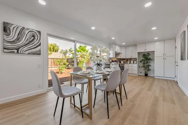 a view of a livingroom with furniture and a potted plant