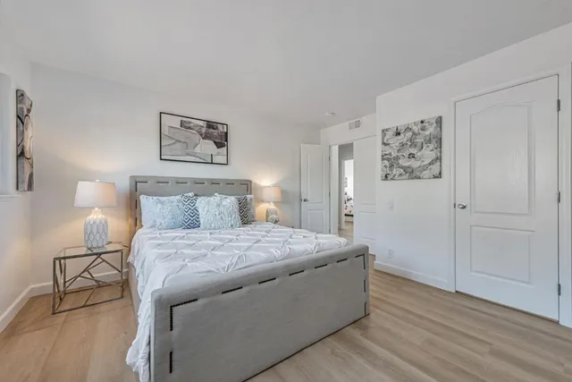 a bathroom with a sink a mirror a toilet and shower