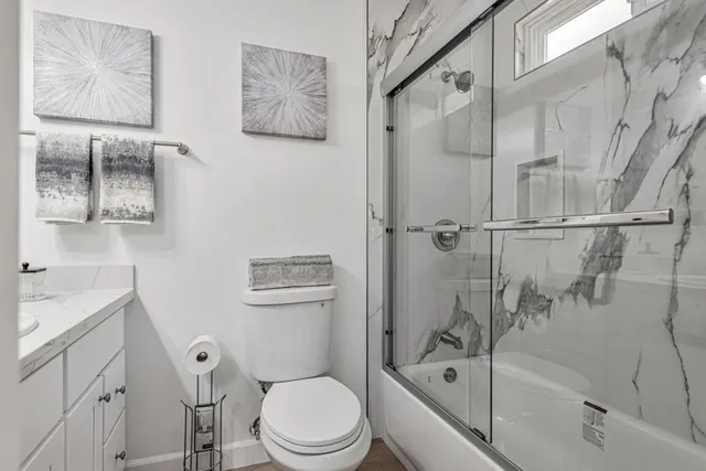 an empty room with a empty space and windows