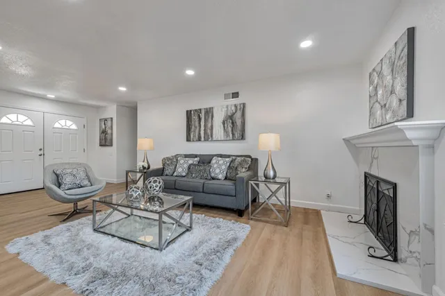 a living room with furniture and a table