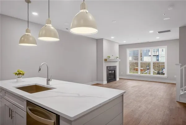 a kitchen with a sink and a refrigerator