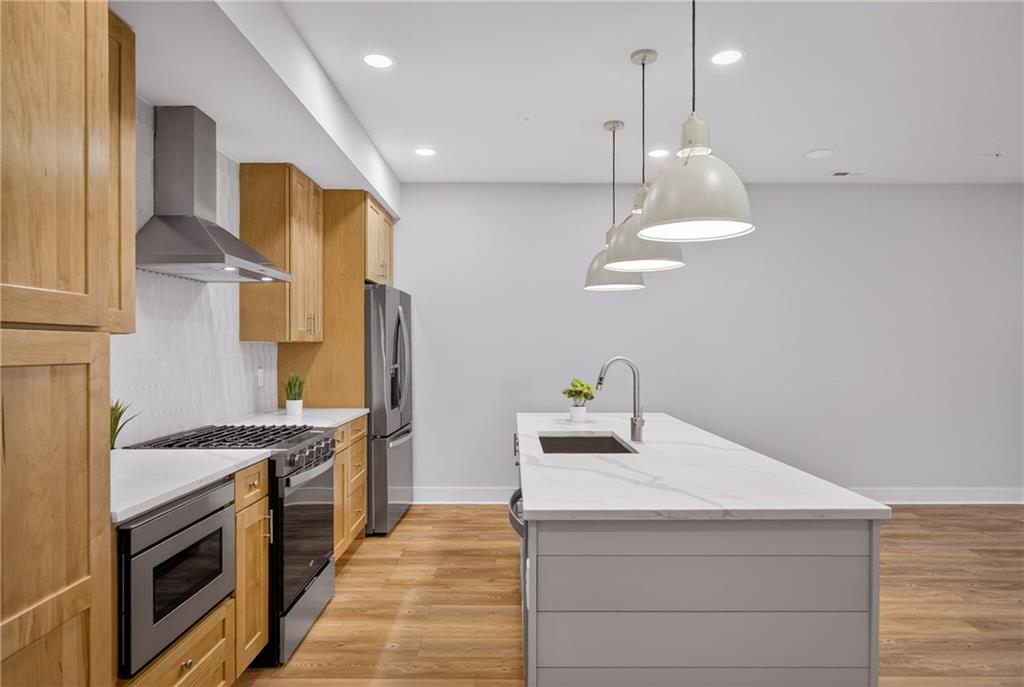 4022 Cottage Way Bridgeville, PA 15017 - Photo 15 of 47 A CHEF'S DELIGHT. STAINLESS APPLIANCES, QUARTZ COUNTERTOPS, PREP ISLAND WITH STORAGE.