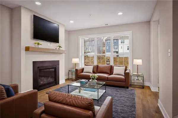 a living room with furniture and a flat screen tv