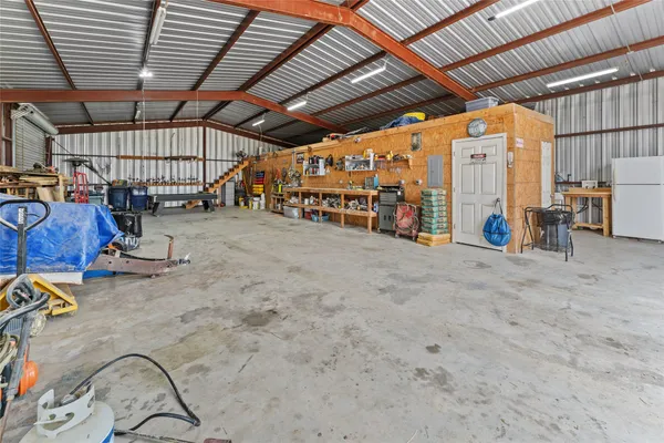 a view of a studio with wooden ceiling