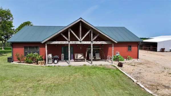 a front view of a house with patio