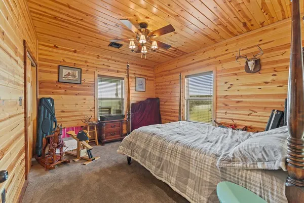 a bedroom with a bed and a dresser