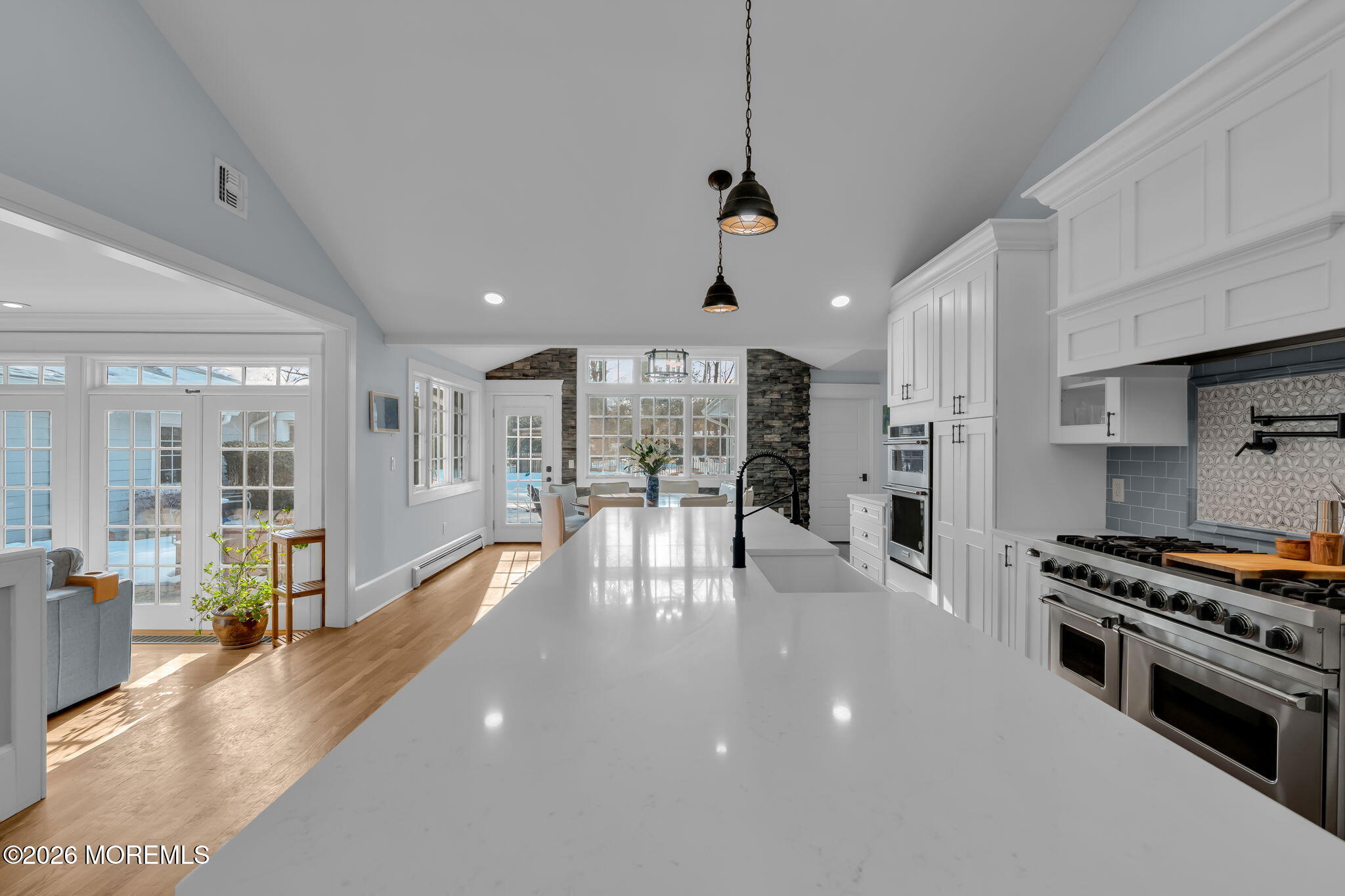2 Tulip Tree Lane Rumson, NJ 07760 - Photo 13 of 55 a view of a kitchen with stainless steel appliances granite countertop a large center island attached withe living room