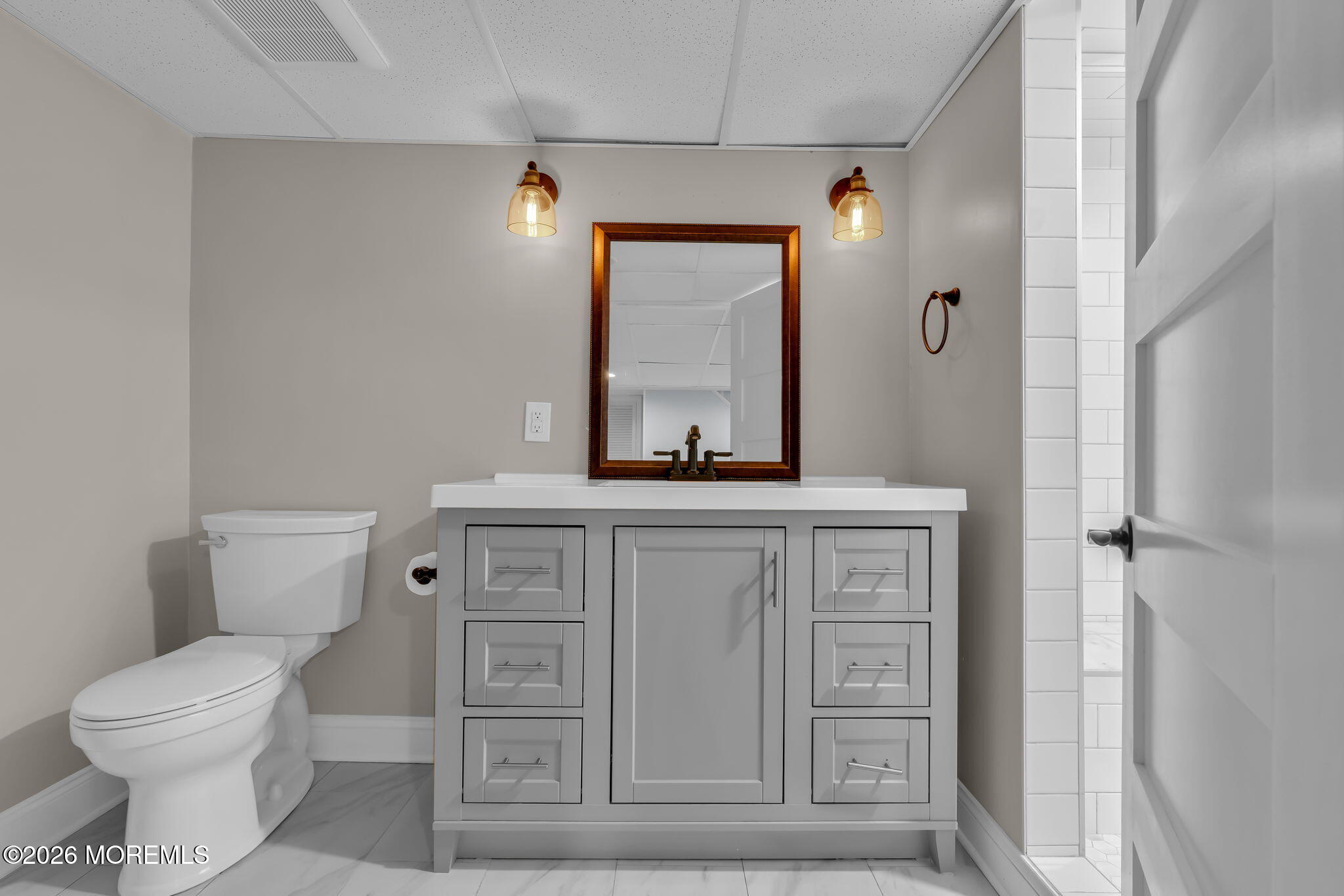 2 Tulip Tree Lane Rumson, NJ 07760 - Photo 22 of 55 a bathroom with a toilet a sink and mirror