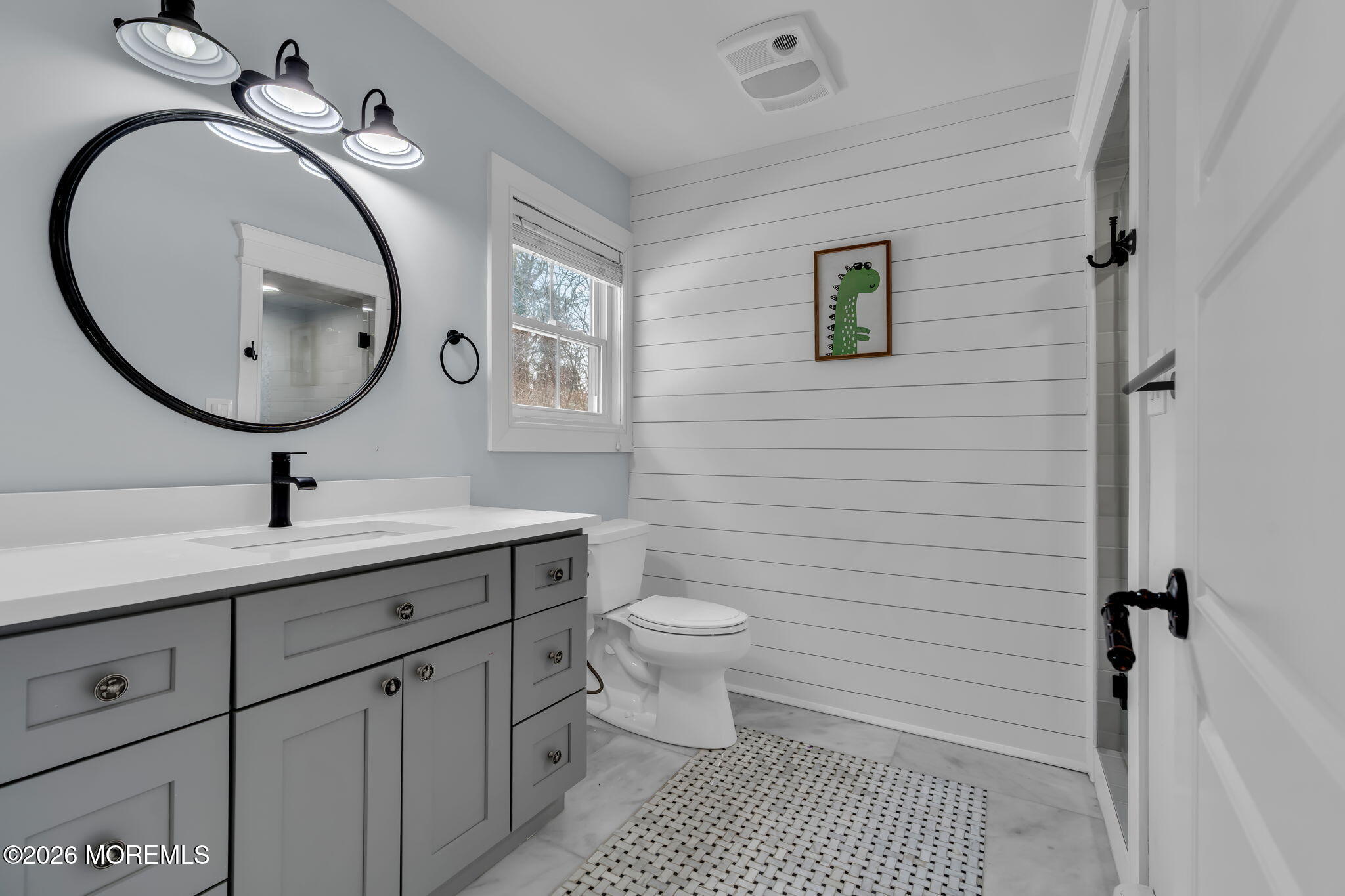 2 Tulip Tree Lane Rumson, NJ 07760 - Photo 32 of 55 a bathroom with a toilet a sink and mirror