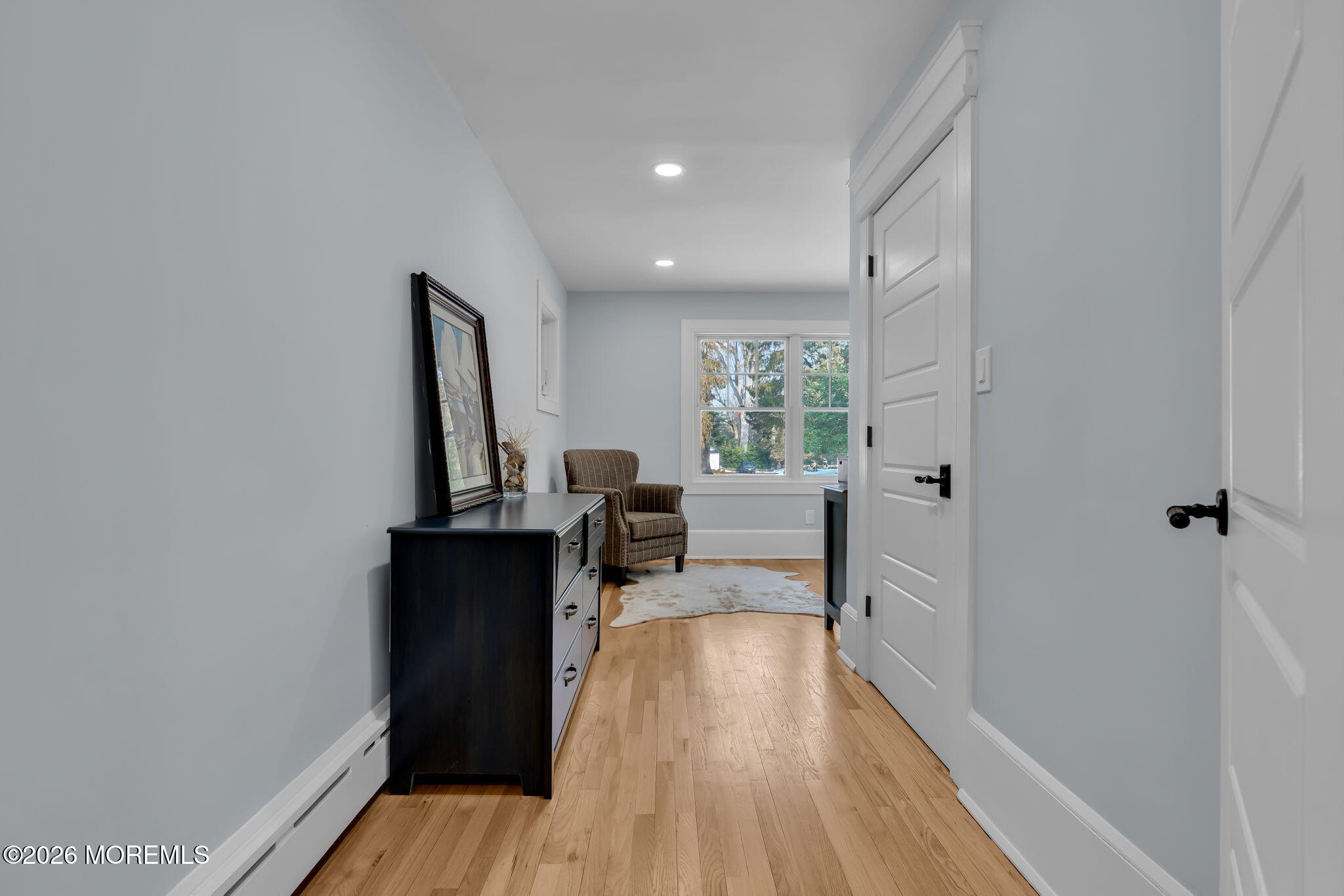 2 Tulip Tree Lane Rumson, NJ 07760 - Photo 36 of 55 a view of a hallway with wooden floor and furniture
