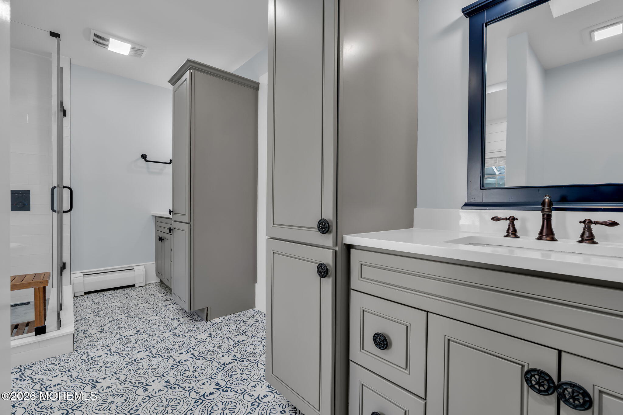 2 Tulip Tree Lane Rumson, NJ 07760 - Photo 44 of 55 a bathroom with a sink and a mirror