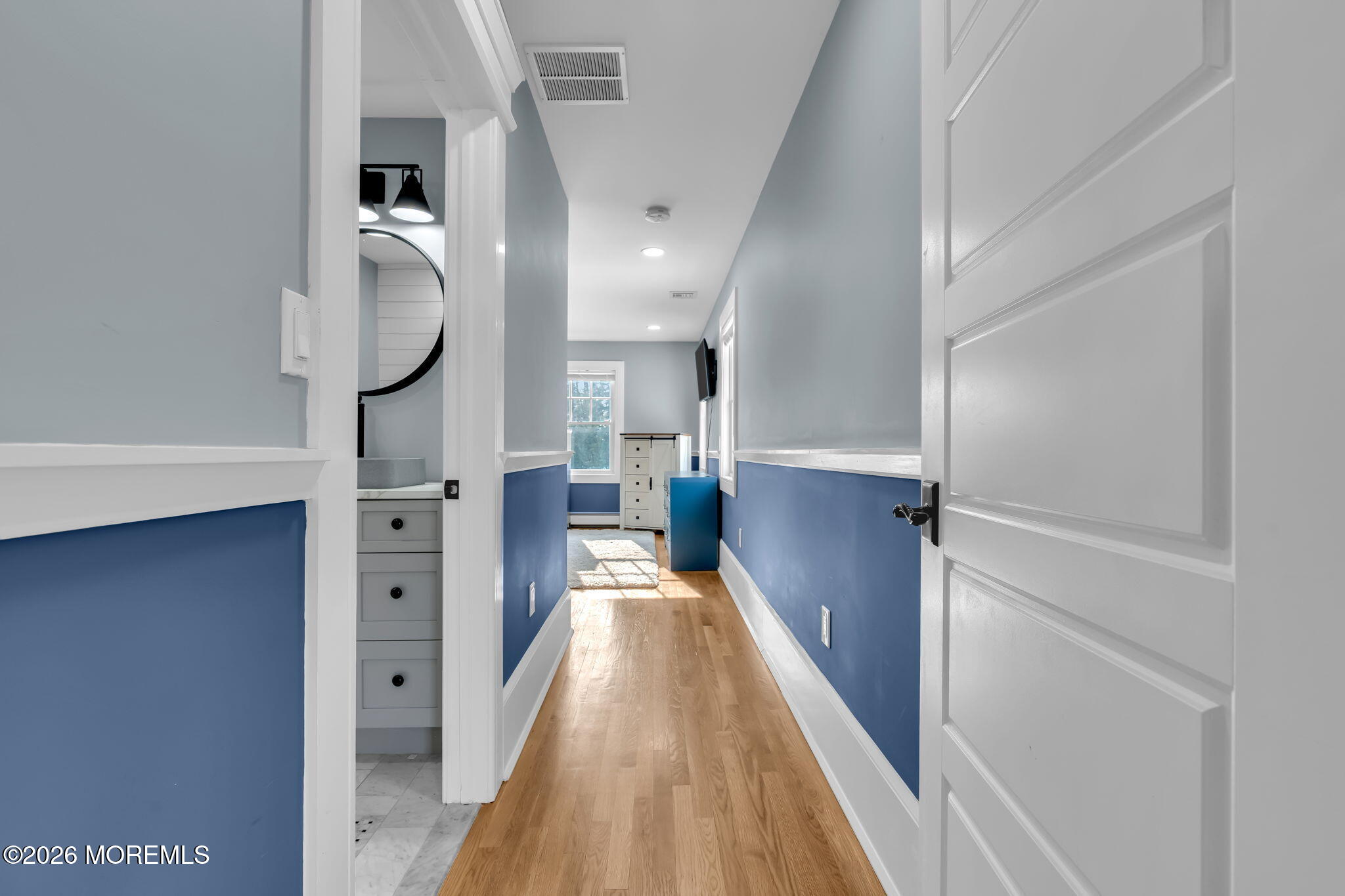2 Tulip Tree Lane Rumson, NJ 07760 - Photo 47 of 55 a view of a hallway with wooden floor and staircase
