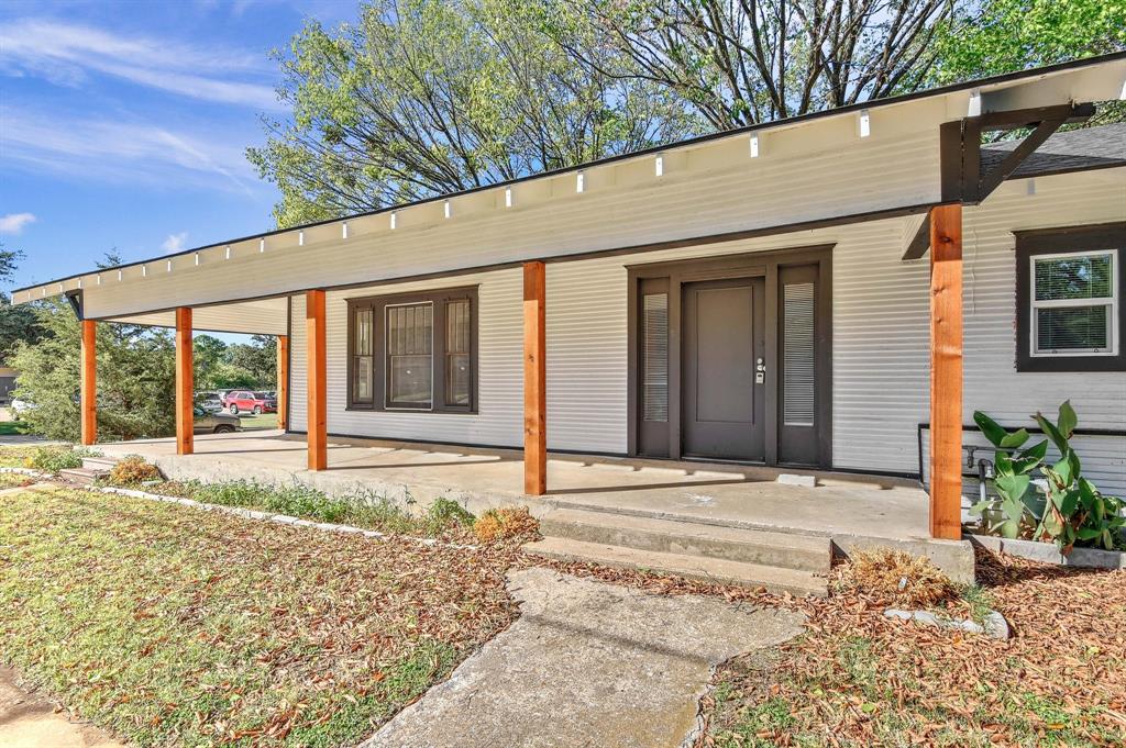 1115 South Rusk Avenue Denison, TX 75020 - Photo 4 of 21 a view of a house with a patio