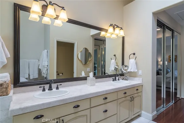 a bedroom with a bed and a mirror