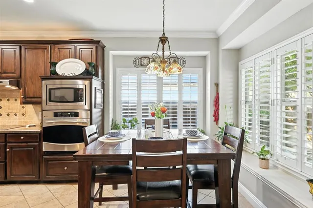 a dining room with furniture and window