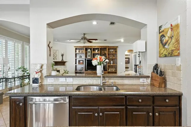 a kitchen with a sink and cabinets