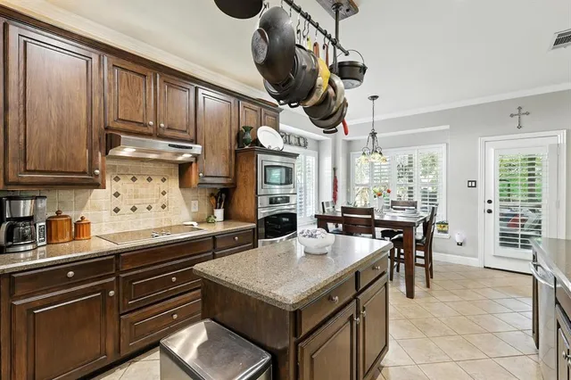 a kitchen with a stove and a table