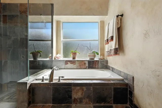 a sink sitting next to a bathroom sink