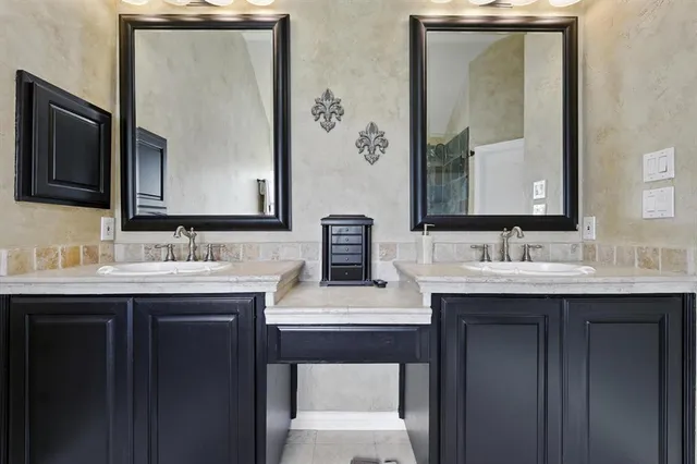 a bathroom with a sink double vanity and a mirror