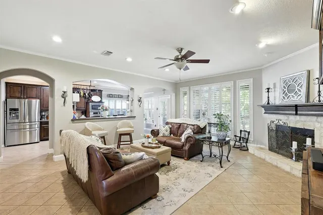 a living room with furniture and fireplace