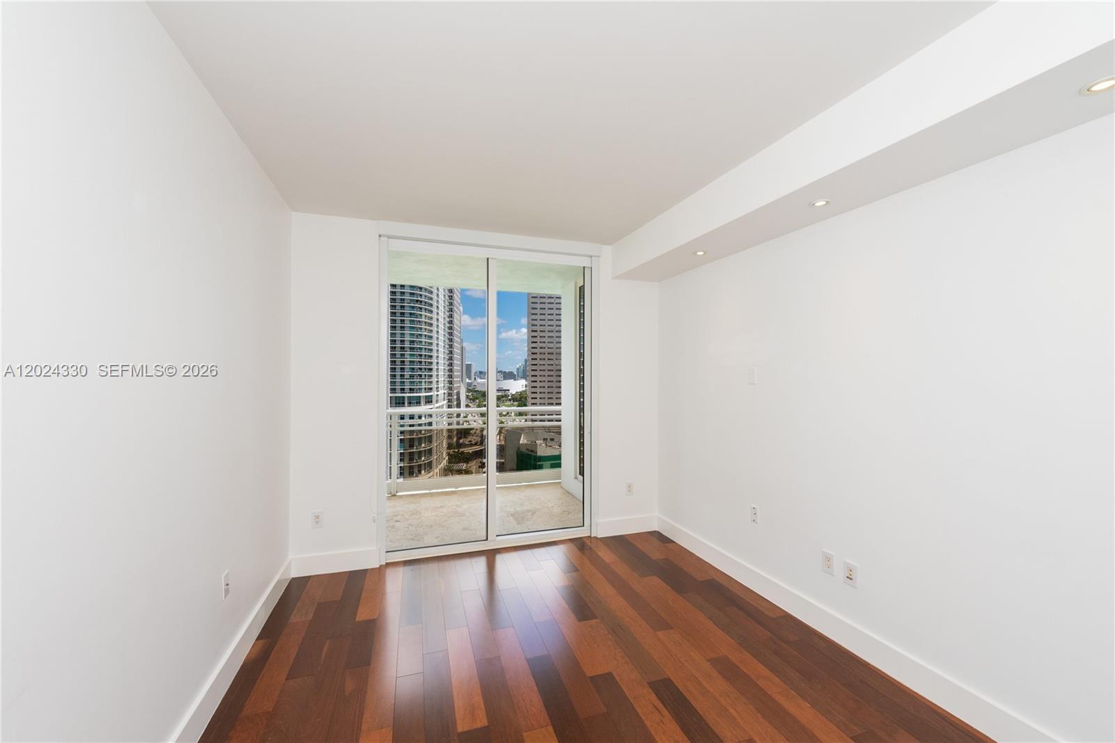 901 Brickell Key Boulevard, Unit 2006 Miami, FL 33131 - Photo 25 of 41 Bedroom 2 - Wood Floors - Recessed Lighting - Sliding Door