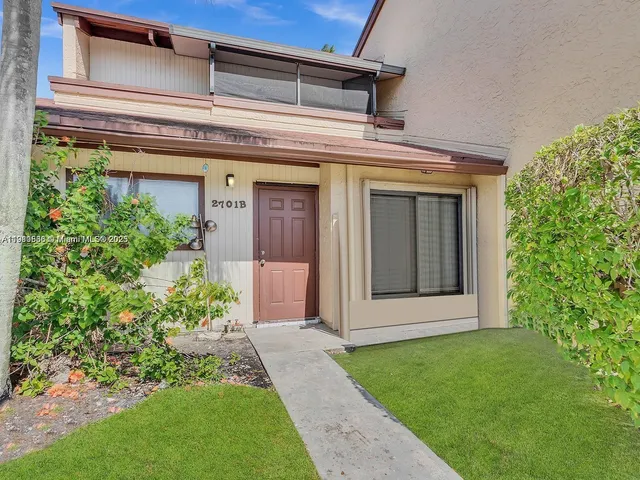 front view of a house with a small yard