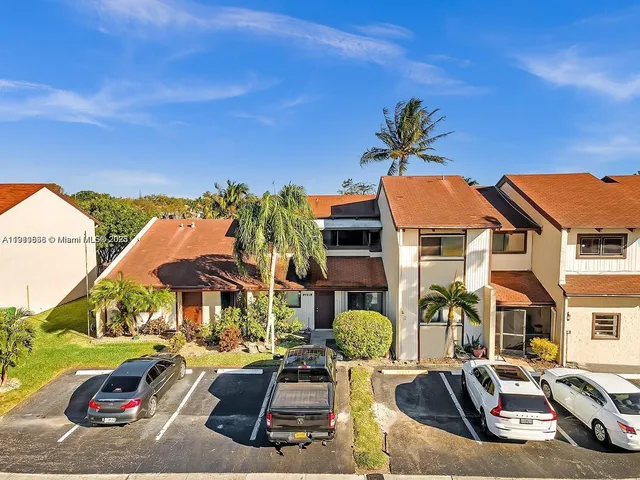 a view of a patio with swimming pool table and chairs