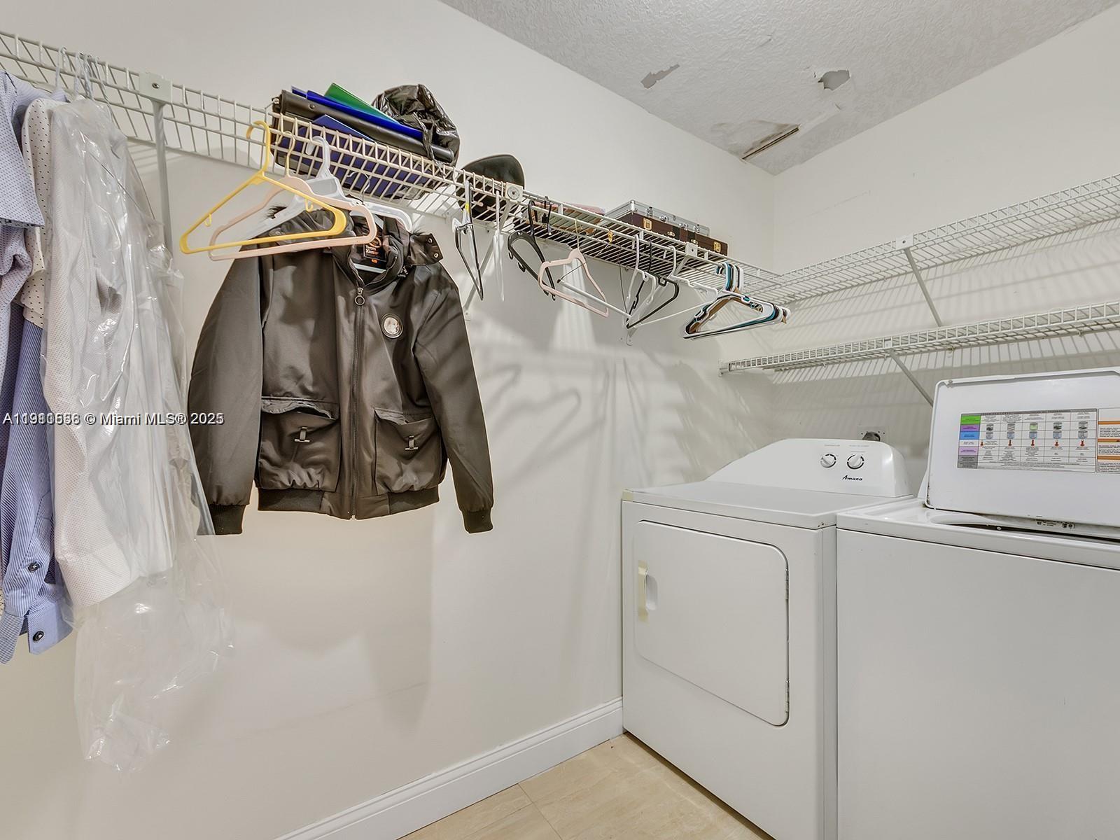 2701 Southwest 58th Manor, Unit B Dania Beach, FL 33312 - Photo 7 of 18 a view of walk in closet with clothes and shoes