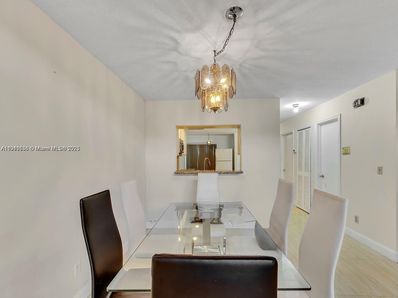 2701 Southwest 58th Manor, Unit B Dania Beach, FL 33312 - Photo 8 of 18 a view of a dining room with furniture and wooden floor