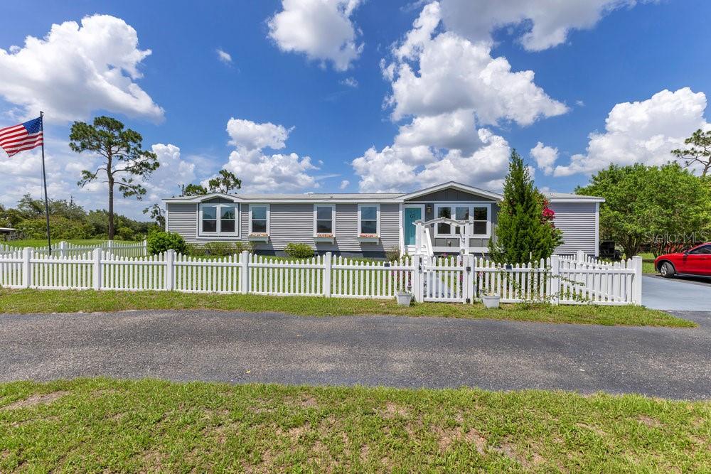 4361 Albritton Road St. Cloud, FL 34772 - Photo 1 of 1 a view of a house in a yard and a fountain